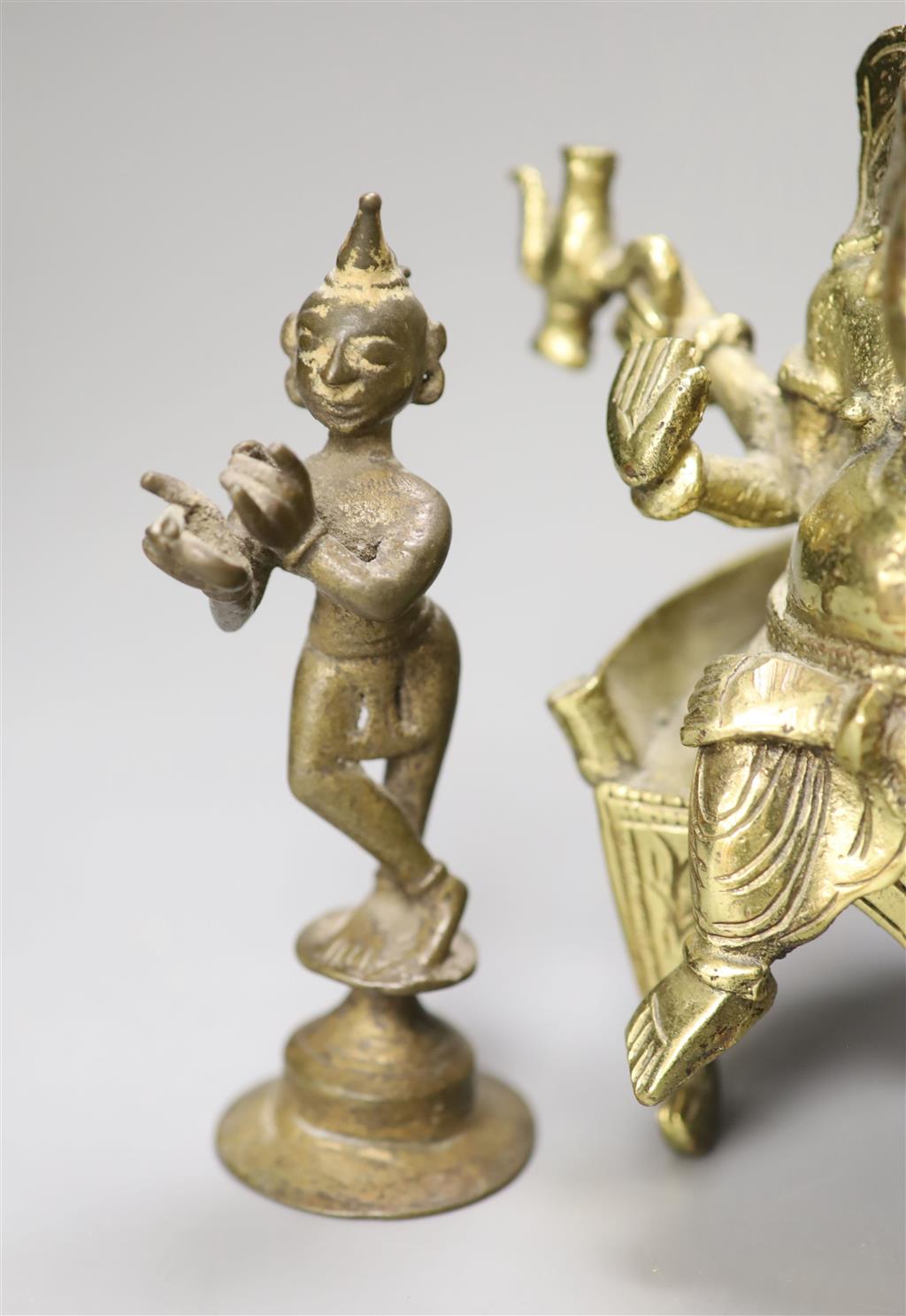 An Indian bronze figure of Ganesh, a bronze of a dancer and a bronze of the Lion of Venice, tallest 18cm